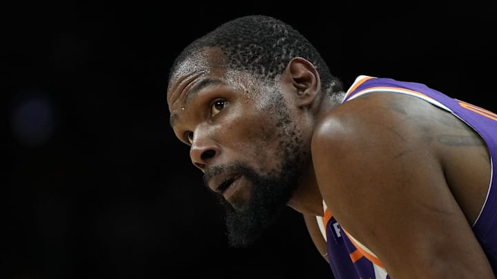 Mar 17, 2025; Phoenix, Arizona, USA; Phoenix Suns forward Kevin Durant (35) during a timeout in the second half against the Toronto Raptors at Footprint Center. Mandatory Credit: Rick Scuteri-Imagn Images