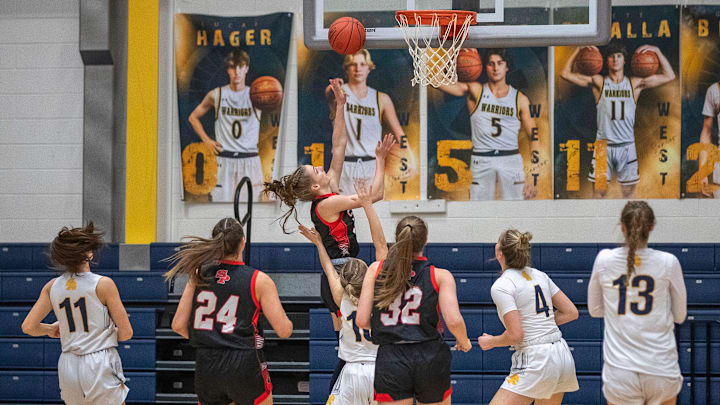Stevens Point Panther freshman Jada Seubert (5) shoots the bal and lands one of the three consecutive baskets in the first minute of the game against the Wausau West Warriors at Wausau West High School in Wausau, Wisconsin on Friday, January 26, 2024. SPASH won, 65-50.