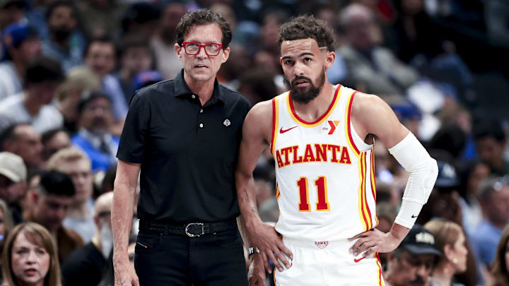 Apr 2, 2025; Dallas, Texas, USA;  Atlanta Hawks head coach Quin Snyder speaks with Atlanta Hawks guard Trae Young (11) during the first half against the Dallas Mavericks at American Airlines Center. Mandatory Credit: Kevin Jairaj-Imagn Images