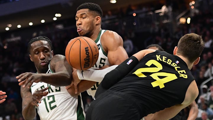 Nov 7, 2024; Milwaukee, Wisconsin, USA: Milwaukee Bucks forward Giannis Antetokounmpo (34) and guard Taurean Prince (12) reach for a rebound against Utah Jazz center Walker Kessler (24) in the first quarter at Fiserv Forum. Mandatory Credit: Benny Sieu-Imagn Images