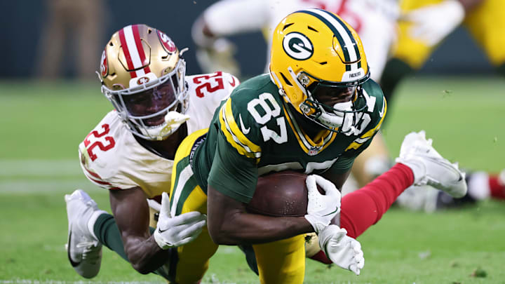 San Francisco 49ers cornerback Isaac Yiadom (L) and Green Bay Packers wide receiver Romeo Doubs (R)