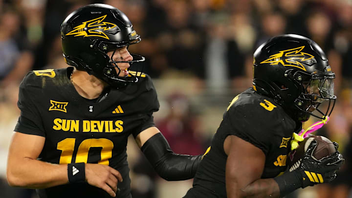 Sep 26, 2025; Tempe, Arizona, USA; Arizona State Sun Devils quarterback Sam Leavitt (10) hands the ball off to  running back Raleek Brown (3) against the TCU Horned Frogs in the second half at Mountain America Stadium, Home of the ASU Sun Devils. Mandatory Credit: Jacob Reiner-Imagn Images