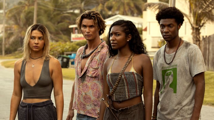Outer Banks. (L to R) Madelyn Cline as Sarah Cameron, Chase Stokes as John B, Carlacia Grant as Cleo, Jonathan Daviss as Pope in episode 301 of Outer Banks. Cr. Jackson Lee Davis/Netflix © 2023