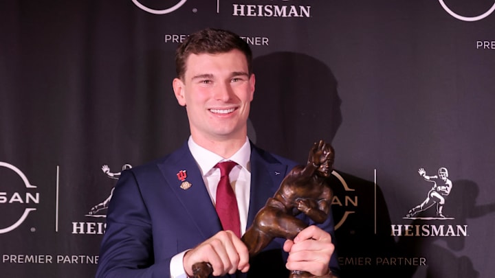 Dec 13, 2025; New York, NY, USA; Indiana Hoosiers quarterback Fernando Mendoza poses for photos with the Heisman trophy during a press conference at the New York Marriott Marquis after winning the award. Mandatory Credit: Brad Penner-Imagn Images