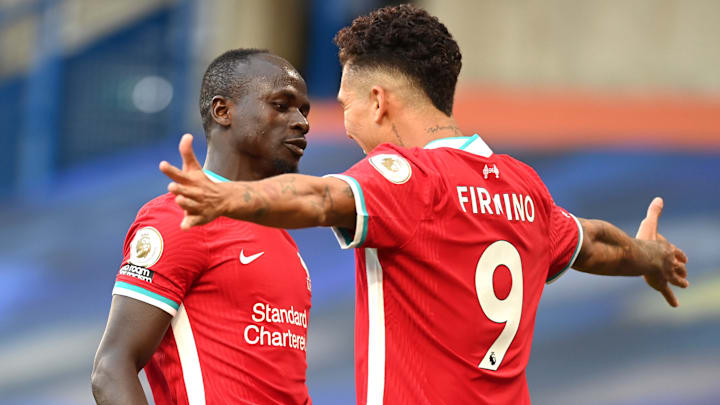 Roberto Firmino celebrating a Liverpool goal with Sadio Mane