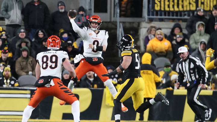 Jan 4, 2025; Pittsburgh, Pennsylvania, USA;  Cincinnati Bengals quarterback Joe Burrow (9) passes to tight end Drew Sample (89) as Pittsburgh Steelers linebacker Alex Highsmith (56) pressures during the second quarter at Acrisure Stadium. Mandatory Credit: Charles LeClaire-Imagn Images