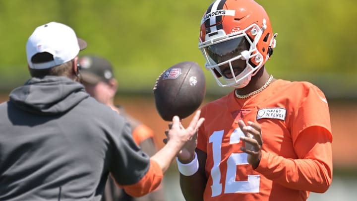 May 10, 2025; Berea, OH, USA; Cleveland Browns quarterback Shedeur Sanders (12) talks to a coach during rookie minicamp at CrossCountry Mortgage Campus. Mandatory Credit: Ken Blaze-Imagn Images May 10, 2025; Berea, OH, USA; Cleveland Browns quarterback Shedeur Sanders (12) talks to a coach during rookie minicamp at CrossCountry Mortgage Campus. Mandatory Credit: Ken Blaze-Imagn Images
