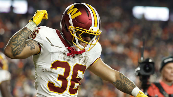 Nov 30, 2025; Landover, Maryland, USA; Washington Commanders running back Chris Rodriguez Jr. (36) celebrates after scoring a touchdown against the Denver Broncos in the second quarter at Northwest Stadium. Mandatory Credit: Geoff Burke-Imagn Images