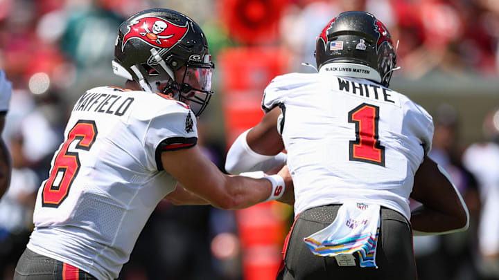 Sep 29, 2024; Tampa, Florida, USA; Tampa Bay Buccaneers quarterback Baker Mayfield (6) hands off to running back Rachaad White (1) against the Philadelphia Eagles in the first quarter at Raymond James Stadium. Mandatory Credit: Nathan Ray Seebeck-Imagn Images