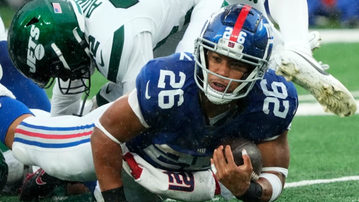The New York Giants' running back Saquon Barkley (26) is shown with the ball against the Jets. The Giants' star running back is on the verge of hitting free agency and there is plenty of debate over his uncertain future with Big Blue. The New York Giants' running back Saquon Barkley (26) is shown with the ball against the Jets. The Giants' star running back is on the verge of hitting free agency and there is plenty of debate over his uncertain future with Big Blue.