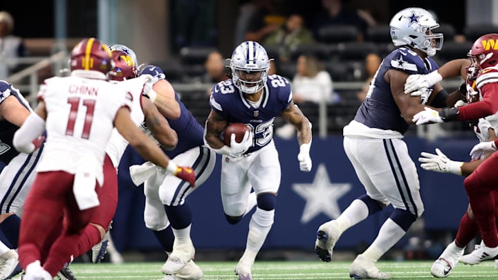 Jan 5, 2025; Arlington, Texas, USA; Dallas Cowboys running back Rico Dowdle (23) runs the ball against the Washington Commanders during the second quarter at AT&T Stadium. Mandatory Credit: Tim Heitman-Imagn Images Jan 5, 2025; Arlington, Texas, USA; Dallas Cowboys running back Rico Dowdle (23) runs the ball against the Washington Commanders during the second quarter at AT&T Stadium. Mandatory Credit: Tim Heitman-Imagn Images