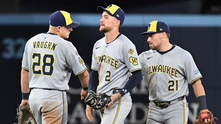 Aug 29, 2025; Toronto, Ontario, CAN; Milwaukee Brewers first baseman Andrew Vaughn celebrates with second baseman Brice Turang (2) and third baseman Caleb Durbin (21) after a win over the Toronto Blue Jays at Rogers Centre. Mandatory Credit: Dan Hamilton-Imagn Images