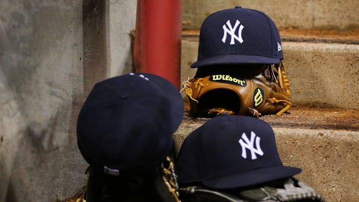 May 9, 2017; Cincinnati, OH, USA; A view of official New Era on field hats of the New York Yankees on the steps of the dugout at Great American Ball Park. Mandatory Credit: Aaron Doster-Imagn Images