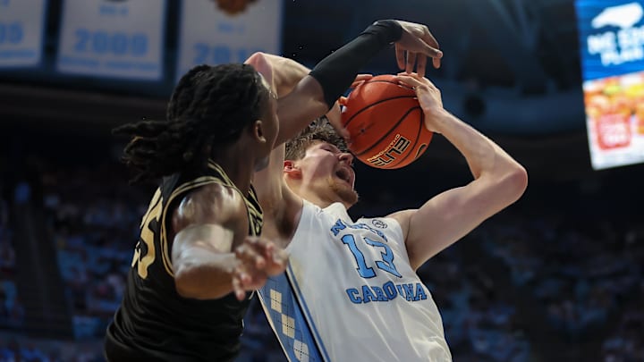 Jan 10, 2026; Chapel Hill, North Carolina, USA;  North Carolina Tar Heels center Henri Veesaar (13) gets fouled by Wake Forest Demon Deacons forward Tre'von Spillers (25) during the second half at Dean E. Smith Center. Mandatory Credit: Cory Knowlton-Imagn Images