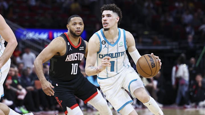 Jan 18, 2023; Houston, Texas, USA;  Charlotte Hornets guard LaMelo Ball (1) controls the ball as Houston Rockets guard Eric Gordon (10) defends during the third quarter at Toyota Center. Troy Taormina-USA TODAY Sports