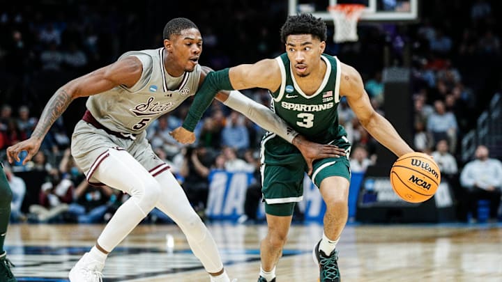 Michigan State guard Jaden Akins (3) dribbles against Mississippi State guard Shawn Jones Jr. (5) during the first half of NCAA tournament West Region first round at Spectrum Center in Charlotte, N.C. on Thursday, March 21, 2024.