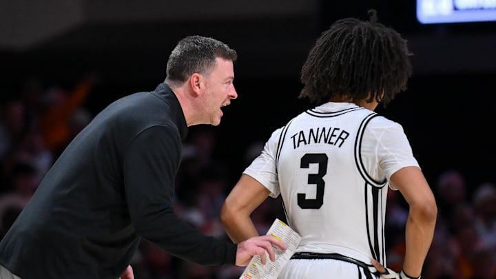 Feb 21, 2026; Nashville, Tennessee, USA;  Vanderbilt Commodores head coach Mark Byington talks with guard Tyler Tanner (3) against the Tennessee Volunteers during the second half at Memorial Gymnasium. Mandatory Credit: Steve Roberts-Imagn Images