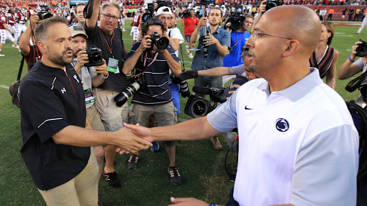 Former Temple and current Nebraska head coach Matt Rhule (left) shakes hands with Penn State head coach James Franklin (right)