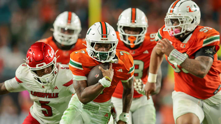 Oct 17, 2025; Miami Gardens, Florida, USA; Miami Hurricanes safety Zechariah Poyser (7) recovers a fumble against the Louisville Cardinals during the fourth quarter at Hard Rock Stadium. Mandatory Credit: Sam Navarro-Imagn Images Oct 17, 2025; Miami Gardens, Florida, USA; Miami Hurricanes safety Zechariah Poyser (7) recovers a fumble against the Louisville Cardinals during the fourth quarter at Hard Rock Stadium. Mandatory Credit: Sam Navarro-Imagn Images
