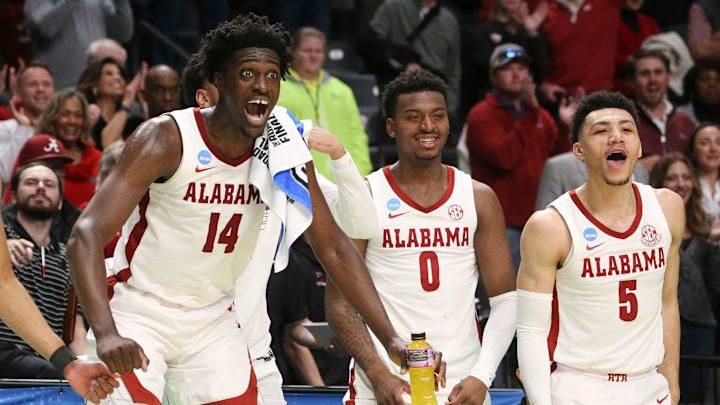 Mar 18, 2023; Birmingham, AL, USA;  Alabama center Charles Bediako (14) reacts to a basket by substitute Alabama guard Delaney Heard (12) at Legacy Arena during the second round of the NCAA Tournament. Alabama advanced to the Sweet Sixteen with a 73-51 win over Maryland. Mandatory Credit: Gary Cosby Jr.-Tuscaloosa News

Ncaa Basketball March Madness Alabama Vs Maryland