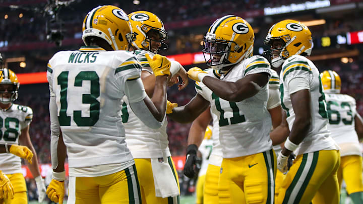 Sep 17, 2023; Atlanta, Georgia, USA; Green Bay Packers wide receiver Jayden Reed (11) celebrates with teammates after a touchdown against the Atlanta Falcons in the second half at Mercedes-Benz Stadium. Mandatory Credit: Brett Davis-USA TODAY Sports