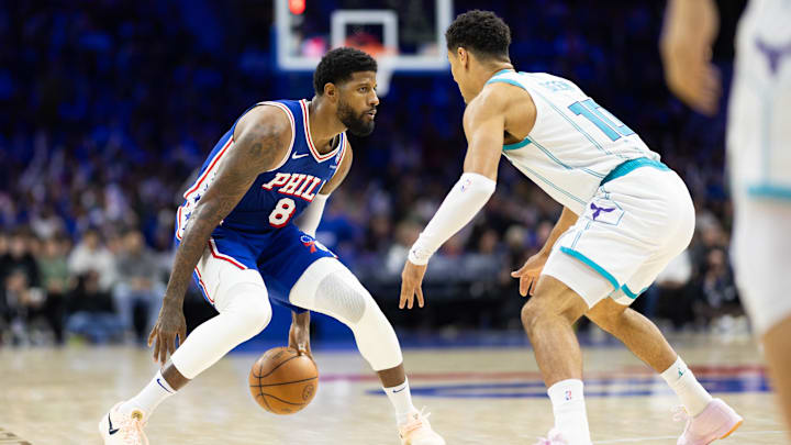 Nov 10, 2024; Philadelphia, Pennsylvania, USA; Philadelphia 76ers forward Paul George (8) dribbles the ball against Charlotte Hornets guard Josh Green (10) during the third quarter at Wells Fargo Center. Mandatory Credit: Bill Streicher-Imagn Images