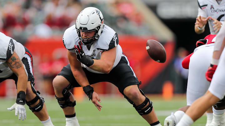Sep 17, 2022; Cincinnati, Ohio, USA; Cincinnati Bearcats offensive lineman Gavin Gerhardt (53) snaps the ball against the Miami Redhawks in the second half at Paycor Stadium. Mandatory Credit: Katie Stratman-Imagn Images