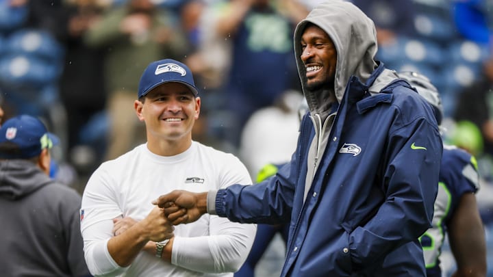 Oct 27, 2024; Seattle, Washington, USA; Seattle Seahawks head coach Mike Macdonald, left, bumps fists with with wide receiver DK Metcalf, right, during pregame warmups against the Buffalo Bills at Lumen Field. Mandatory Credit: Joe Nicholson-Imagn Images Oct 27, 2024; Seattle, Washington, USA; Seattle Seahawks head coach Mike Macdonald, left, bumps fists with with wide receiver DK Metcalf, right, during pregame warmups against the Buffalo Bills at Lumen Field. Mandatory Credit: Joe Nicholson-Imagn Images