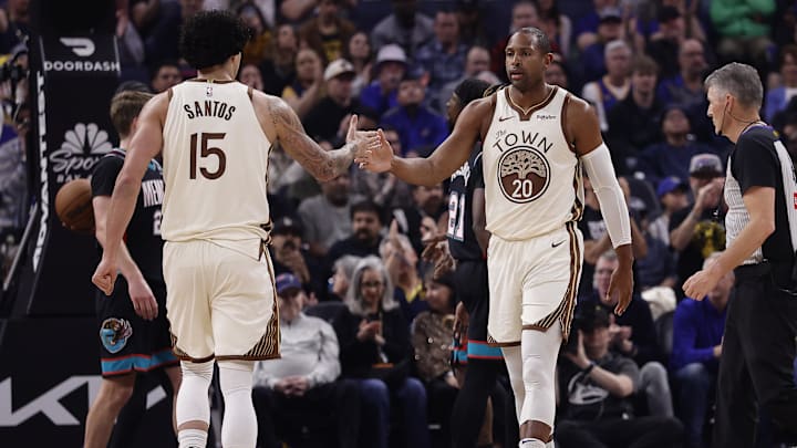Feb 9, 2026; San Francisco, California, USA; Golden State Warriors forward Gui Santos (15) high fives center Al Horford (20) after Horford scored against the Memphis Grizzlies during the first quarter at Chase Center. Mandatory Credit: Kelley L Cox-Imagn Images