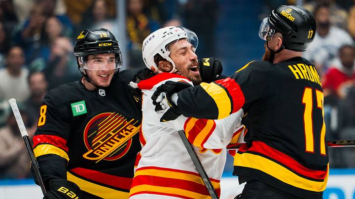 Oct 9, 2025; Vancouver, British Columbia, CAN; Vancouver Canucks forward Drew O'Connor (18) and defenseman Filip Hronek (17) wrestle with Calgary Flames forward Ryan Lomberg (70) in the second period at Rogers Arena. Mandatory Credit: Bob Frid-Imagn Images Oct 9, 2025; Vancouver, British Columbia, CAN; Vancouver Canucks forward Drew O'Connor (18) and defenseman Filip Hronek (17) wrestle with Calgary Flames forward Ryan Lomberg (70) in the second period at Rogers Arena. Mandatory Credit: Bob Frid-Imagn Images