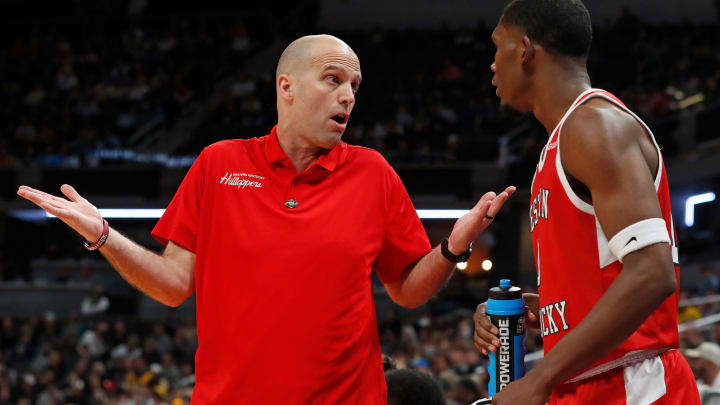 Western Kentucky Hilltoppers head coach Steve Lutz talks to Western Kentucky Hilltoppers guard
