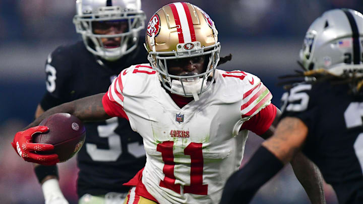 January 1, 2023; Paradise, Nevada, USA; San Francisco 49ers wide receiver Brandon Aiyuk (11) runs the ball against the Las Vegas Raiders during the second half at Allegiant Stadium. Mandatory Credit: Gary A. Vasquez-USA TODAY Sports