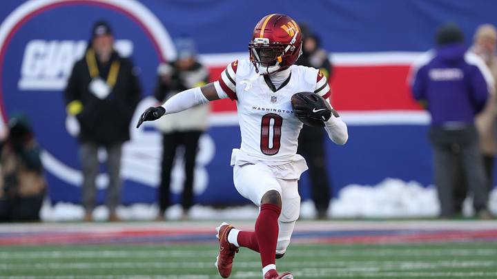 Dec 14, 2025; East Rutherford, New Jersey, USA; Washington Commanders cornerback Mike Sainristil (0) runs the ball after an interception during the second quarter against the New York Giants at MetLife Stadium. Mandatory Credit: Vincent Carchietta-Imagn Images Dec 14, 2025; East Rutherford, New Jersey, USA; Washington Commanders cornerback Mike Sainristil (0) runs the ball after an interception during the second quarter against the New York Giants at MetLife Stadium. Mandatory Credit: Vincent Carchietta-Imagn Images