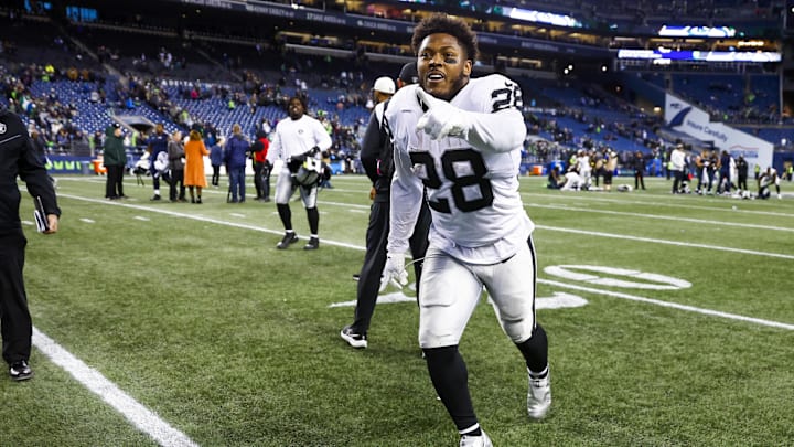 Nov 27, 2022; Seattle, Washington, USA; Las Vegas Raiders running back Josh Jacobs (28) celebrates following a 40-34 overtime victory against the Seattle Seahawks at Lumen Field. Mandatory Credit: Joe Nicholson-Imagn Images