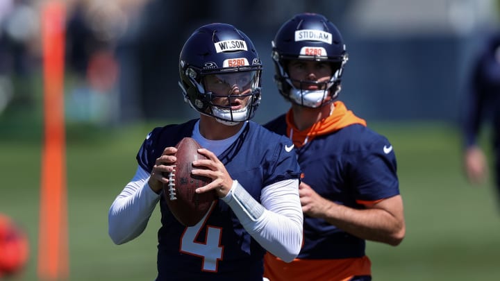 May 23, 2024; Englewood, CO, USA; Denver Broncos quarterback Zach Wilson (4) and quarterback Jarrett Stidham (8) during organized team activities at Centura Health Training Center. Mandatory Credit: Isaiah J. Downing-USA TODAY Sports