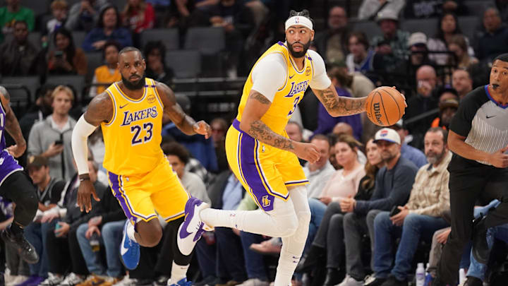 Dec 19, 2024; Sacramento, California, USA; Los Angeles Lakers center Anthony Davis (3) dribbles the ball next to forward LeBron James (23) against the Sacramento Kings in the first quarter at the Golden 1 Center. Mandatory Credit: Cary Edmondson-Imagn Images Dec 19, 2024; Sacramento, California, USA; Los Angeles Lakers center Anthony Davis (3) dribbles the ball next to forward LeBron James (23) against the Sacramento Kings in the first quarter at the Golden 1 Center. Mandatory Credit: Cary Edmondson-Imagn Images