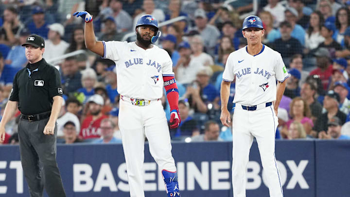 Aug 17, 2025; Toronto, Ontario, CAN; Toronto Blue Jays first baseman Vladimir Guerrero Jr. (27) celebrates hitting a single against the Texas Rangers during the first inning at Rogers Centre. 