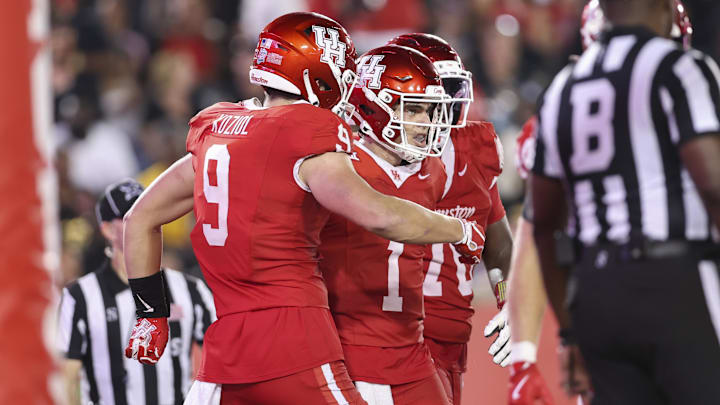 Sep 12, 2025; Houston, Texas, USA; Houston Cougars quarterback Conner Weigman (1) celebrates after running with the ball for a touhdown during the fourth quarter against the Colorado Buffaloes at TDECU Stadium. Mandatory Credit: Troy Taormina-Imagn Images