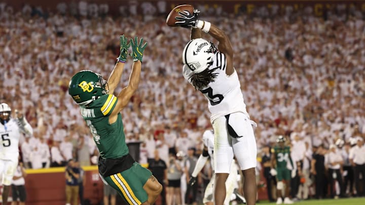 Oct 5, 2024; Ames, Iowa, USA; Iowa State Cyclones defensive back Jontez Williams (3) intercepts a pass intended for Baylor Bears wide receiver Monaray Baldwin (4) at Jack Trice Stadium. Mandatory Credit: Reese Strickland-Imagn Images