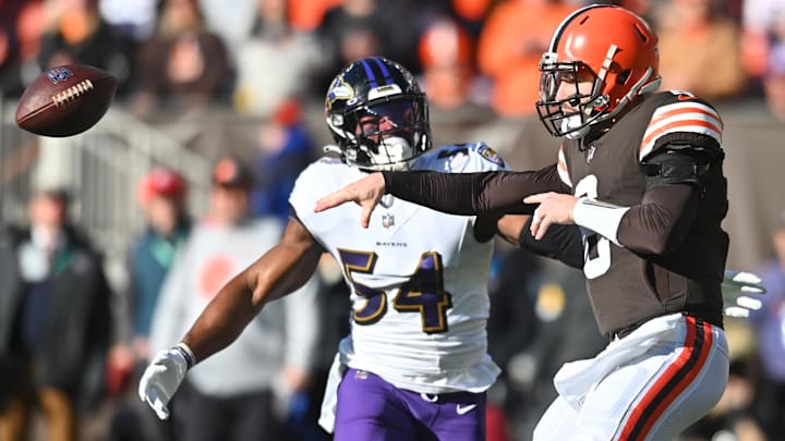 Cleveland Browns quarterback Baker Mayfield (6) throws a pass as Baltimore Ravens outside linebacker Tyus Bowser (54) defends during the first quarter at FirstEnergy Stadium in a 2021 game.