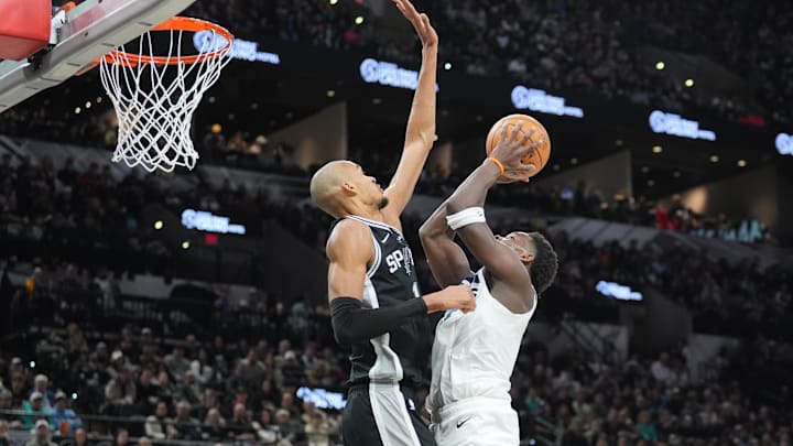 Jan 17, 2026; San Antonio, Texas, USA; Minnesota Timberwolves guard Anthony Edwards (5) shoots against San Antonio Spurs forward Victor Wembanyama (1) in the first half at Frost Bank Center.