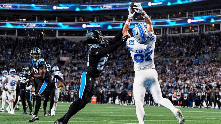 Detroit Lions tight end Sam LaPorta (87) makes a catch for a touchdown against Carolina Panthers cornerback Akayleb Evans (29) during the second half at Bank of America Stadium in Charlotte on Sunday, Oct. 4, 2026.