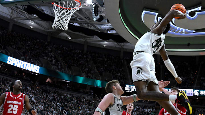 Michigan State Spartans forward Coen Carr (55) goes up for a dunk Michigan State Spartans forward Coen Carr (55) goes up for a dunk