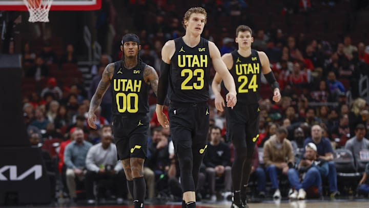 Nov 6, 2023; Chicago, Illinois, USA; Utah Jazz forward Lauri Markkanen (23), Utah Jazz guard Jordan Clarkson (00) and Utah Jazz center Walker Kessler (24) walk on the court during the first half of a basketball game against the Chicago Bulls at United Center. Mandatory Credit: Kamil Krzaczynski-Imagn Images