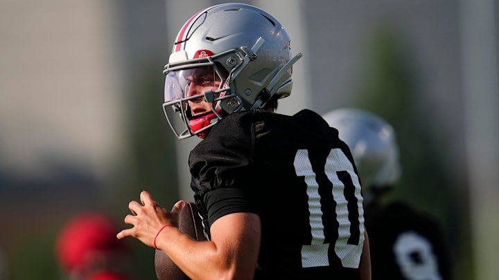 Ohio State Buckeyes quarterback Julian Sayin (10) takes a snap during football training camp at the Woody Hayes Athletic Center on Aug. 1, 2025.