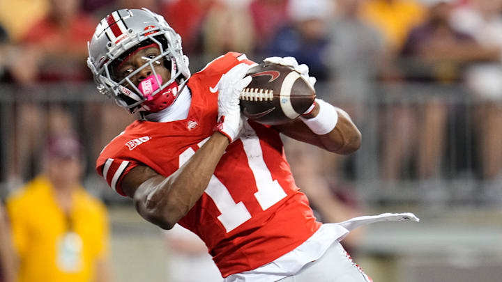 Ohio State Buckeyes wide receiver Carnell Tate (17) catches a touchdown pass during the first half of the NCAA football game against the Minnesota Golden Gophers at Ohio Stadium in Columbus on Oct. 4, 2025.