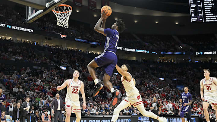 Mar 19, 2026; Portland, OR, USA; High Point Panthers guard Rob Martin (3) shoots against Wisconsin Badgers guard Nick Boyd (2) during the second half of a first round game of the men's 2026 NCAA Tournament at Moda Center. 