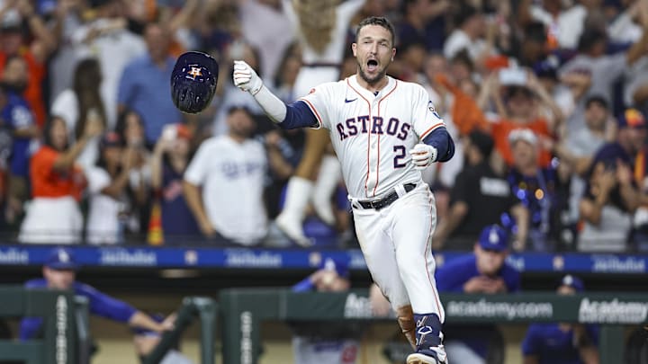 Jul 27, 2024; Houston, Texas, USA; Houston Astros third baseman Alex Bregman (2) throws his helmet after hitting a walk-off home run during the ninth inning against the Los Angeles Dodgers at Minute Maid Park.