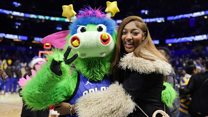 Chicago Sky forward Angel Reese hugs Orlando Magic Stuff during an NBA game against the Boston Celtics. Chicago Sky forward Angel Reese hugs Orlando Magic Stuff during an NBA game against the Boston Celtics.
