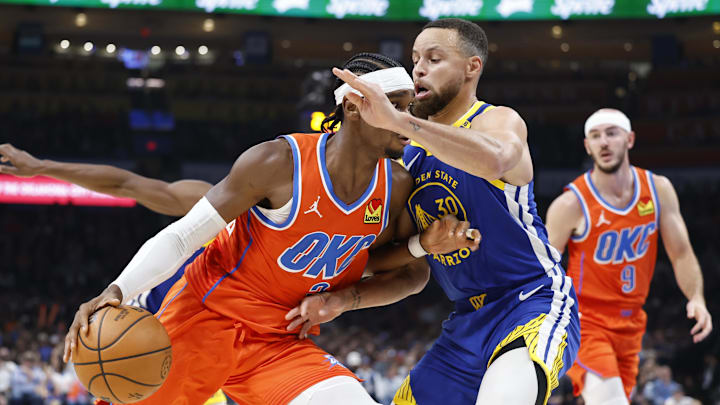 Nov 10, 2024; Oklahoma City, Oklahoma, USA; Oklahoma City Thunder guard Shai Gilgeous-Alexander (2) drives to the basket against Golden State Warriors guard Stephen Curry (30) during the second quarter at Paycom Center. Mandatory Credit: Alonzo Adams-Imagn Images